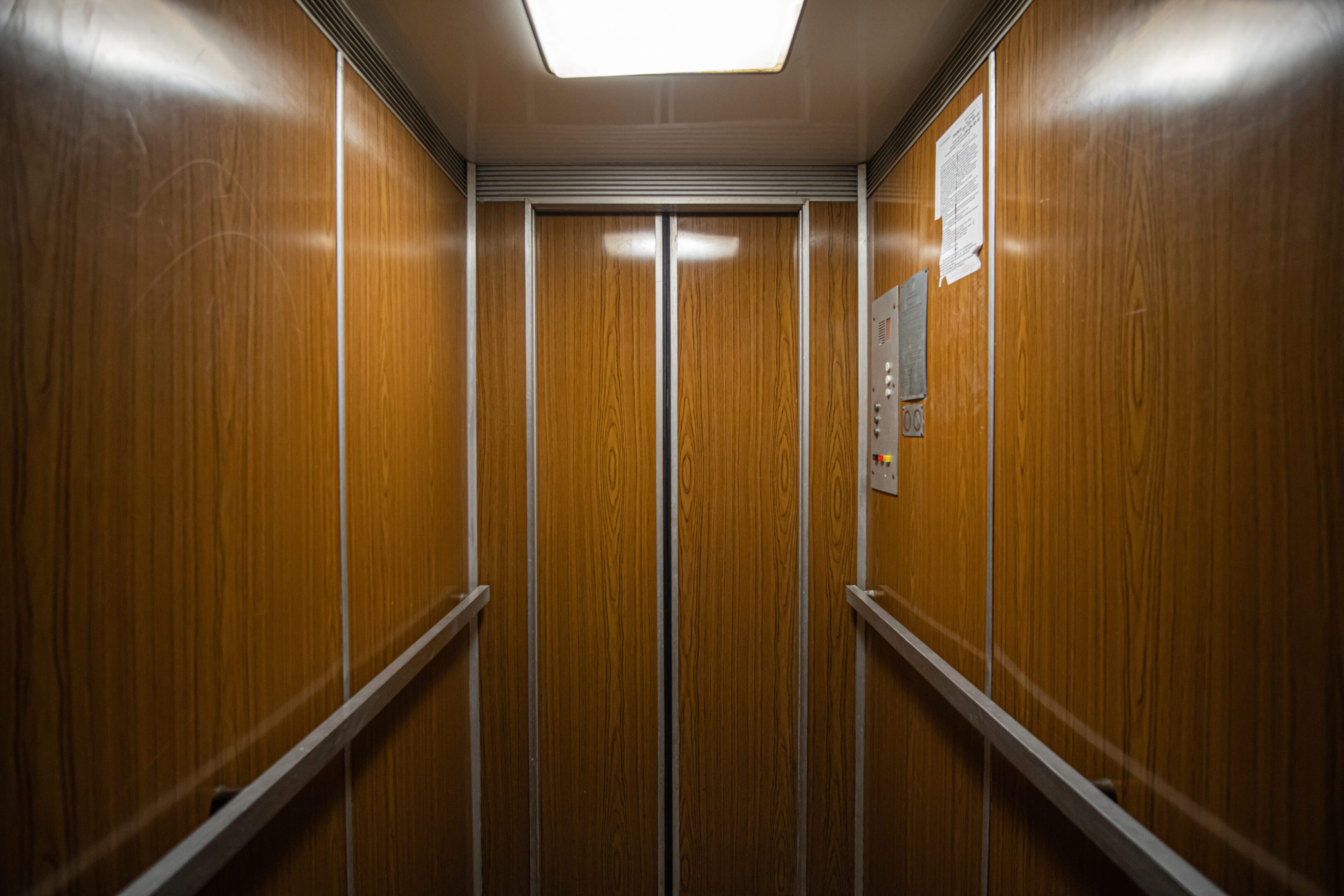 Custom wood panel elevator cab interior fabricated by CNS